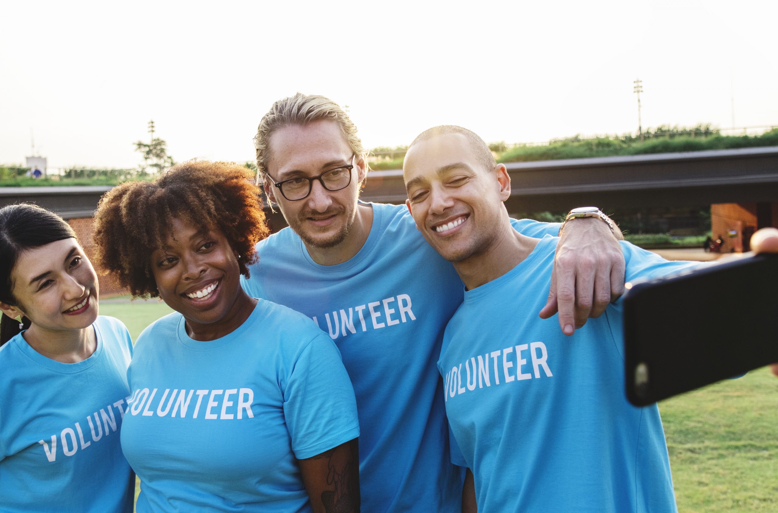 Diverse volunteers taking a selfie together
