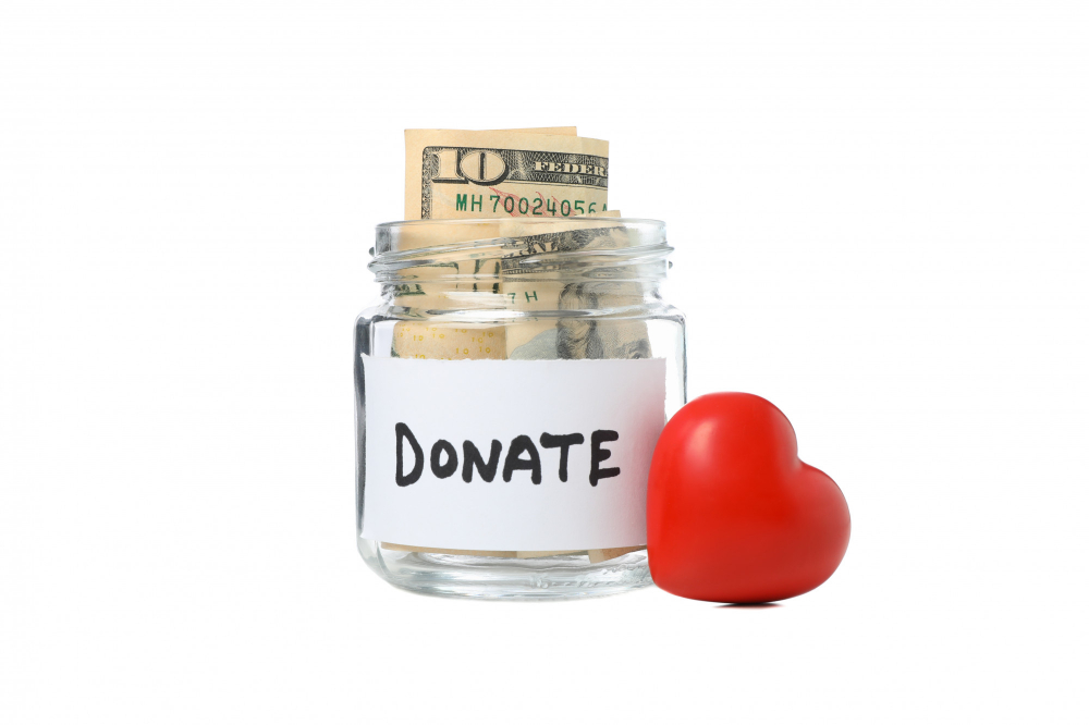 heart-donate-glass-jar-with-money-isolated-white-space