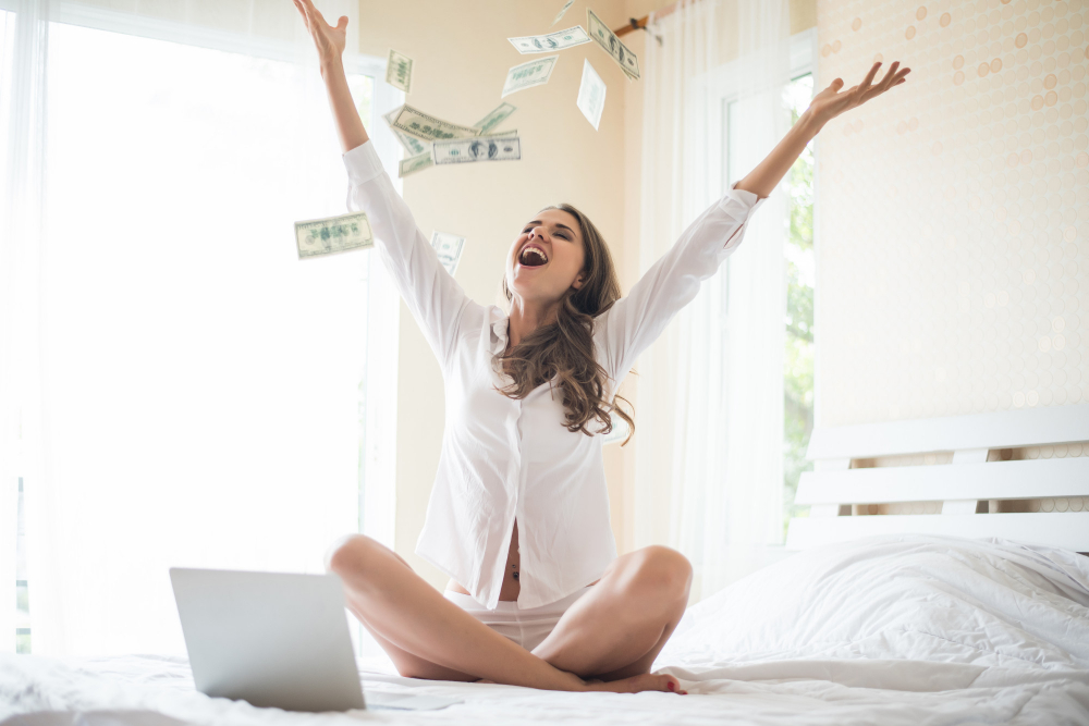 woman-with-dollar-bank-note-bed