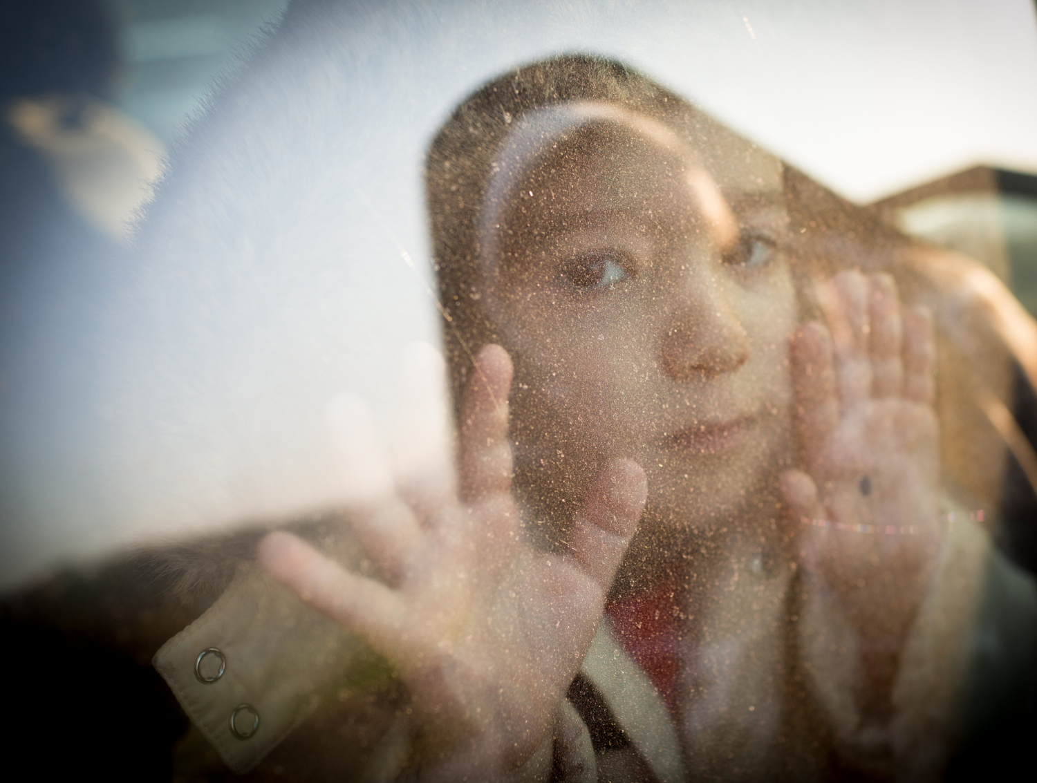 little-boy-looking-through-window