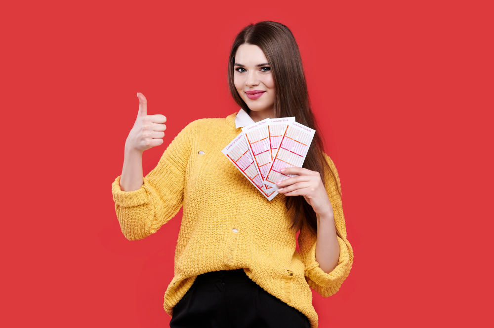woman-showing-thumb-up-gesture-holding-lottery-tickets